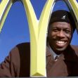 Retired MLB star Herb Washington smiling behind the McDonald's golden arches. Retired MLB star Herb Washington smiling behind the McDonald's golden arches.