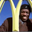 Herb Washington poses outside his McDonalds restaurant in Niles, Ohio, in 2002