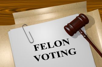 An image depicting a gavel resting on a sheet of paper with the text "FELON VOTING," symbolizing the issue of voting rights for felons in Florida.