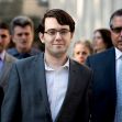 Image of Martin Shkreli surrounded by individuals as he leaves a courthouse. Image of Martin Shkreli surrounded by individuals as he leaves a courthouse.