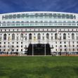 California Supreme Court building with a blue sky and grassy area in the foreground. California Supreme Court building with a blue sky and grassy area in the foreground.