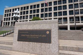 Sign for the United States Department of Labor building in front of the structure.