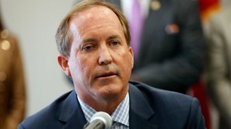 Texas Attorney General Ken Paxton speaking during a press conference regarding the lawsuit against the Biden administration's deportation freeze.