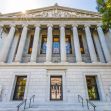 Image of the exterior of a court building in California, featuring its classical architectural design with tall columns and statues. Image of the exterior of a court building in California, featuring its classical architectural design with tall columns and statues.