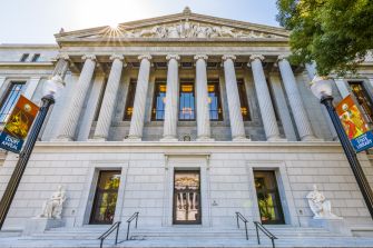 Image of the exterior of a court building in California, featuring its classical architectural design with tall columns and statues.