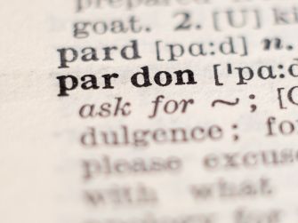 Definition of the word "pardon" from a dictionary page.