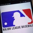 Logo of Major League Baseball displayed on a smartphone screen. Logo of Major League Baseball displayed on a smartphone screen.