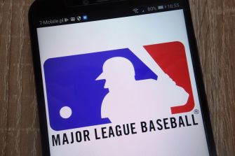 Logo of Major League Baseball displayed on a smartphone screen.