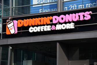 Dunkin' Donuts storefront sign displaying the brand name and offerings.