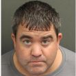 Mugshot of a man arrested for attempted theft at Disney, wearing a gray shirt and with short hair. Mugshot of a man arrested for attempted theft at Disney, wearing a gray shirt and with short hair.