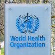 Signage of the World Health Organization (WHO). Signage of the World Health Organization (WHO).