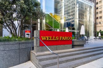 Wells Fargo bank sign in front of a modern building.