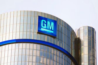 GM logo on the company headquarters building, representing its commitment to electric vehicles and sustainability.