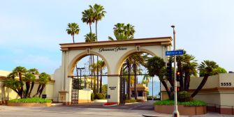 The entrance to Paramount Pictures, surrounded by palm trees.