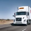 A freight truck operated by Yellow Transportation driving on a highway. A freight truck operated by Yellow Transportation driving on a highway.