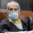 Robert Durst in court, wearing a mask and hospital gown, as he faces charges related to the murder of his first wife, Kathie Durst. Robert Durst in court, wearing a mask and hospital gown, as he faces charges related to the murder of his first wife, Kathie Durst.