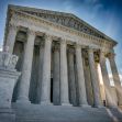 Image of the U.S. Supreme Court building with its iconic columns and statue in front. Image of the U.S. Supreme Court building with its iconic columns and statue in front.