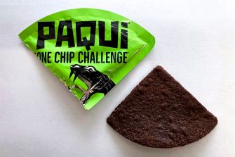 Paqui One Chip Challenge packaging with a single chip displayed beside it.