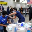 Mass. Gov Charlie Baker reacts to a person getting his vaccination as he tours the Reggie Lewis Mass Vaccination site on March 11, 2021 in Boston, MA.