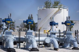 Pipelines and storage tanks at a fuel facility, highlighting infrastructure related to the Colonial Pipeline incident.