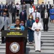 A group of lawmakers stands on the steps of a government building during a press conference advocating for the George Floyd Justice in Policing Act. A group of lawmakers stands on the steps of a government building during a press conference advocating for the George Floyd Justice in Policing Act.