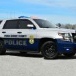 Prince George's County police vehicle parked on a gravel surface with emergency lights activated. Prince George's County police vehicle parked on a gravel surface with emergency lights activated.