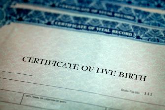 Birth certificates laid out with the title "Certificate of Live Birth."