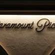 Signage of Paramount Pictures illuminated at night. Signage of Paramount Pictures illuminated at night.