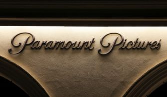 Signage of Paramount Pictures illuminated at night.