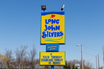 Sign for Long John Silver’s restaurant displaying promotions and branding.