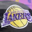 Logo of the Los Angeles Lakers basketball team featuring a basketball and team name in purple and yellow. Logo of the Los Angeles Lakers basketball team featuring a basketball and team name in purple and yellow.