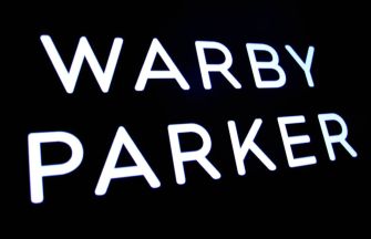 Signage displaying the name "Warby Parker."