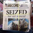 Stack of newspapers featuring a headline about the seizure of the Marion County Record, with images of a raid and the caption "SEIZED ... but not silenced." Stack of newspapers featuring a headline about the seizure of the Marion County Record, with images of a raid and the caption "SEIZED ... but not silenced."