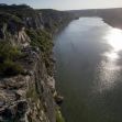 Aerial view of the Pecos River, highlighting the surrounding cliffs and vegetation under sunlight. Aerial view of the Pecos River, highlighting the surrounding cliffs and vegetation under sunlight.