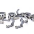 A collection of Filshie clips, a medical device used in tubal ligation procedures for permanent birth control. A collection of Filshie clips, a medical device used in tubal ligation procedures for permanent birth control.