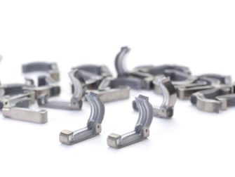 A collection of Filshie clips, a medical device used in tubal ligation procedures for permanent birth control.