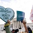 Protesters hold signs supporting abortion rights outside the U.S. Supreme Court. Protesters hold signs supporting abortion rights outside the U.S. Supreme Court.