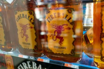 Bottles of Fireball Cinnamon displayed on a store shelf.