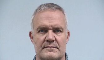 Mugshot of a former teacher charged with battery after slapping a student.