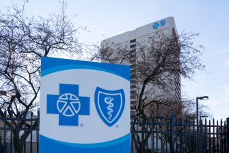 Signage of Blue Cross Blue Shield in front of their office building.
