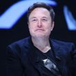 Elon Musk at a public event or conference, seated and speaking with a serious expression. Elon Musk at a public event or conference, seated and speaking with a serious expression.