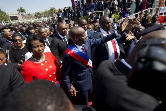 Former Haitian President Jovenel Moise and his wife, Martine Moise, at a public event.