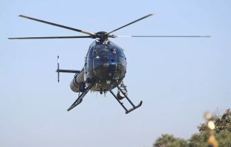 A police helicopter in flight, relevant to a legal case involving the aiming of a laser pointer at an aircraft.