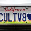 A California vanity license plate displaying the characters "CULTV8" and a heart symbol, highlighting the theme of personalized license plate messaging. A California vanity license plate displaying the characters "CULTV8" and a heart symbol, highlighting the theme of personalized license plate messaging.