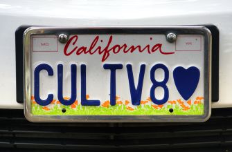 A California vanity license plate displaying the characters "CULTV8" and a heart symbol, highlighting the theme of personalized license plate messaging.