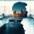A silhouette of a student with a background featuring a classroom and a city skyline, symbolizing the intersection of education and immigration policies. A silhouette of a student with a background featuring a classroom and a city skyline, symbolizing the intersection of education and immigration policies.