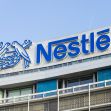 Nestlé logo displayed on the exterior of a corporate building. Nestlé logo displayed on the exterior of a corporate building.
