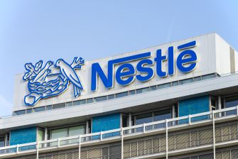 Nestlé logo displayed on the exterior of a corporate building.