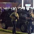 Individuals carrying firearms during a protest in Kenosha, Wisconsin. Individuals carrying firearms during a protest in Kenosha, Wisconsin.