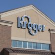 Kroger store exterior sign against a clear blue sky. Kroger store exterior sign against a clear blue sky.